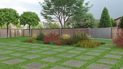 The bed in full summer bloom with a wealth of color - tufted hair grass creates delicate golden accents among the greenery